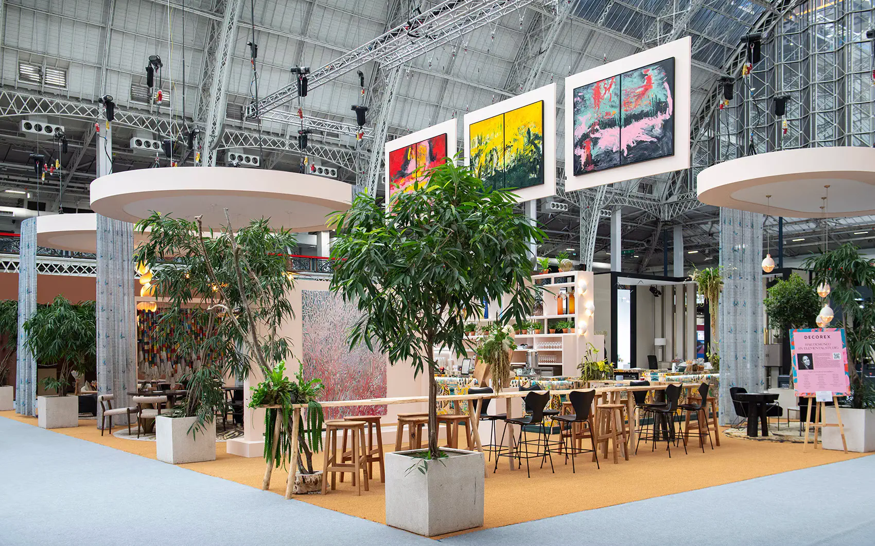 Custom feature bar with biophilic design and artwork displays at the Decorex interior design trade show.