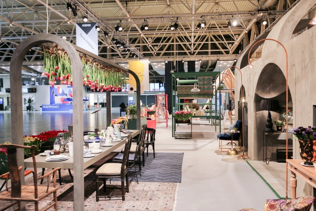 Conceptual theme dining exhibition with suspended floral ceiling installation at Formex.