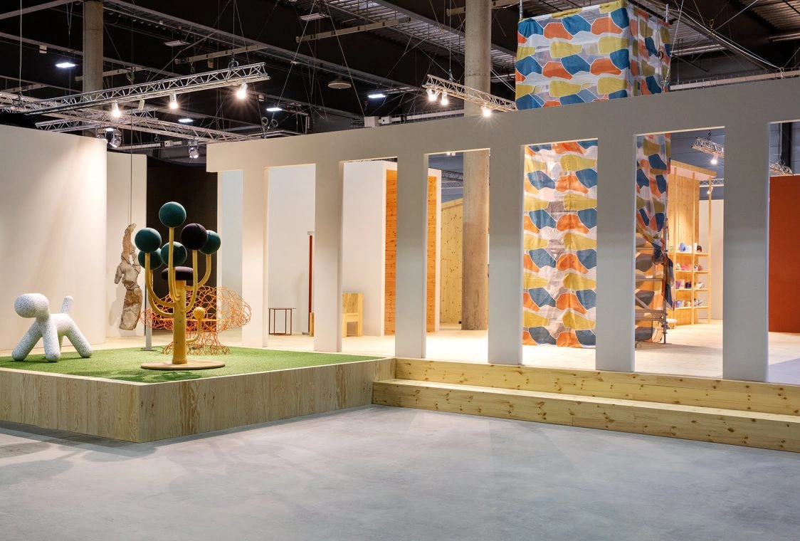 Avant-garde furniture trend exhibition platform with architectural pillars at Oslo Design Fair.