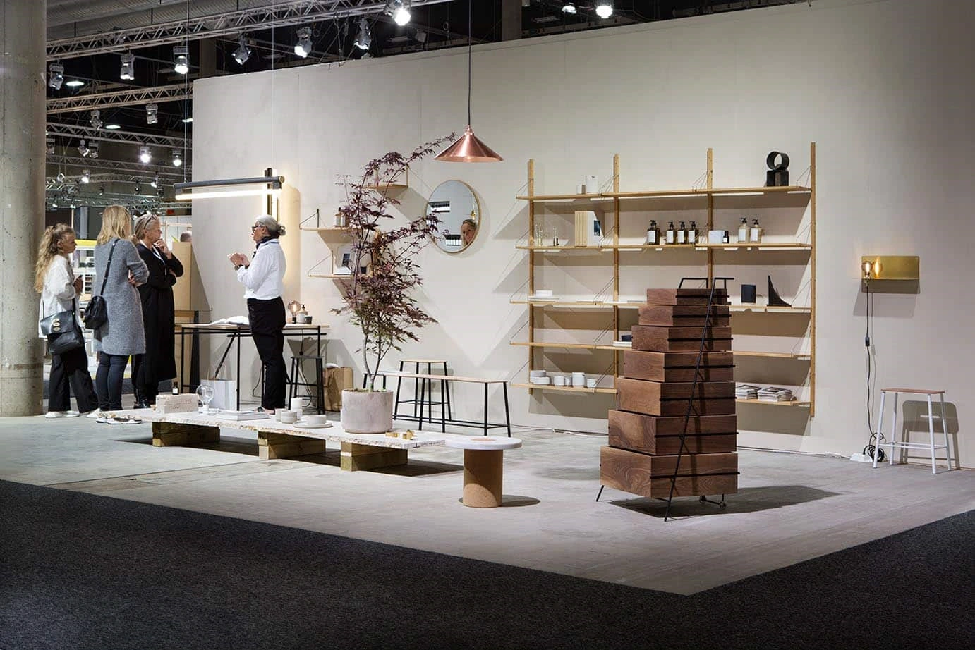 Frama minimalist wooden shelving and furniture exhibition stand at Oslo Design Fair.