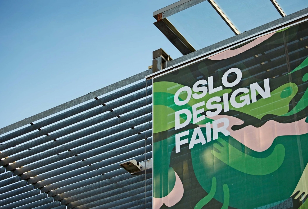Large outdoor Oslo Design Fair entrance banner on the venue building exterior.